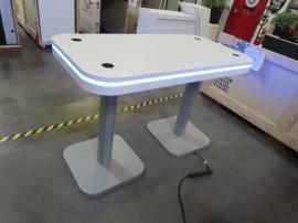 Custom Reception Counter with Storage and Programmable RGB Accent Lights and MOD-1473 Conference Charging Table with Wireless Charging Pads and Programmable RGB Perimeter Lights -- View 3